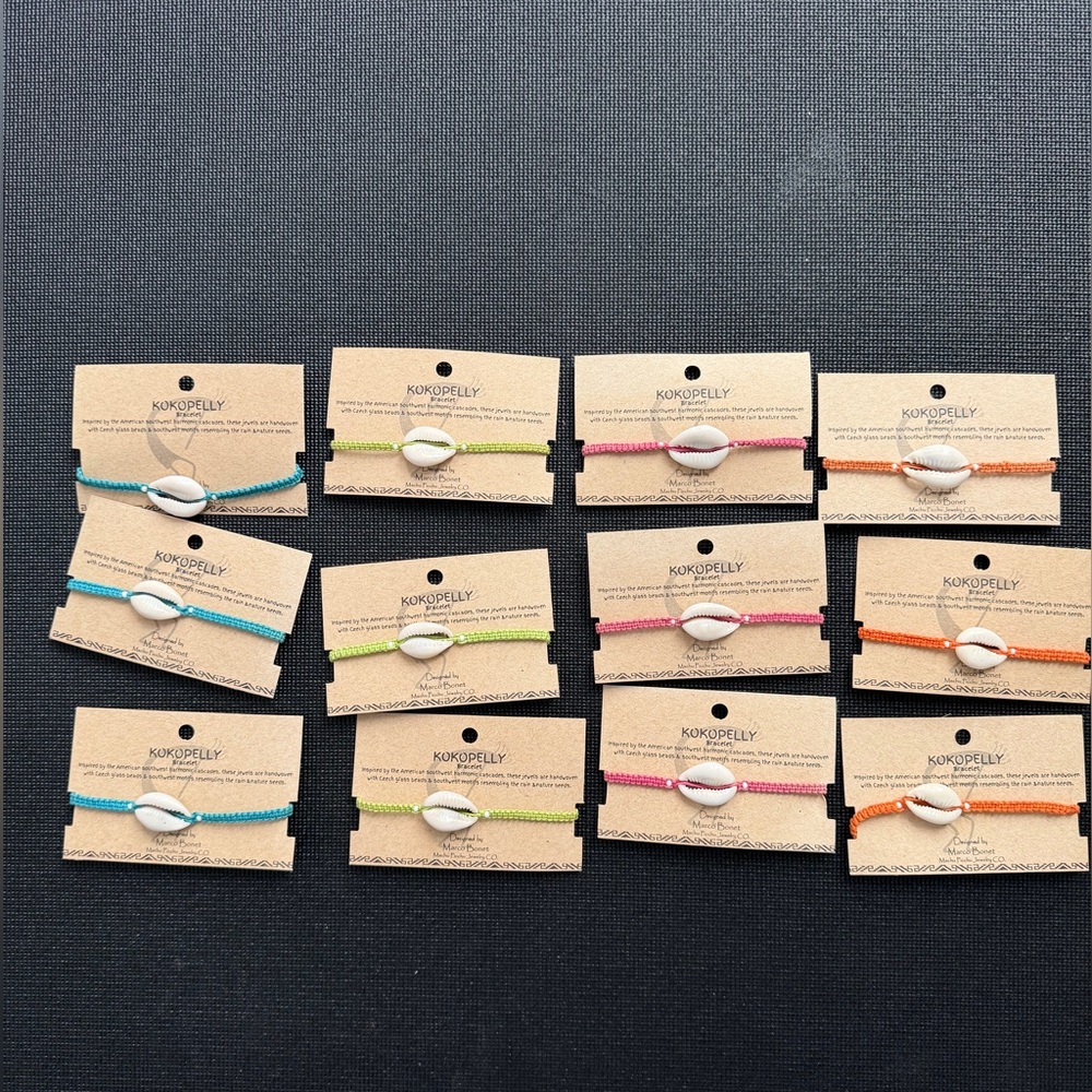 12 cowrie shell beach bracelets. New